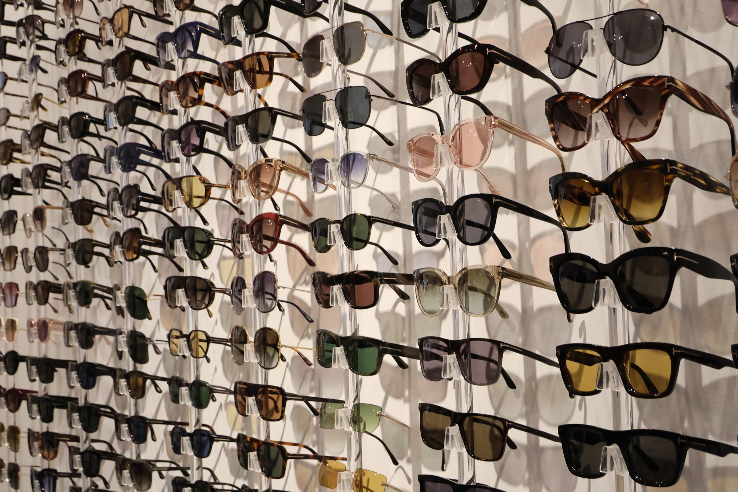 Receding display wall of designer sunglasses at Boardwalk Eye Care in Cambridge