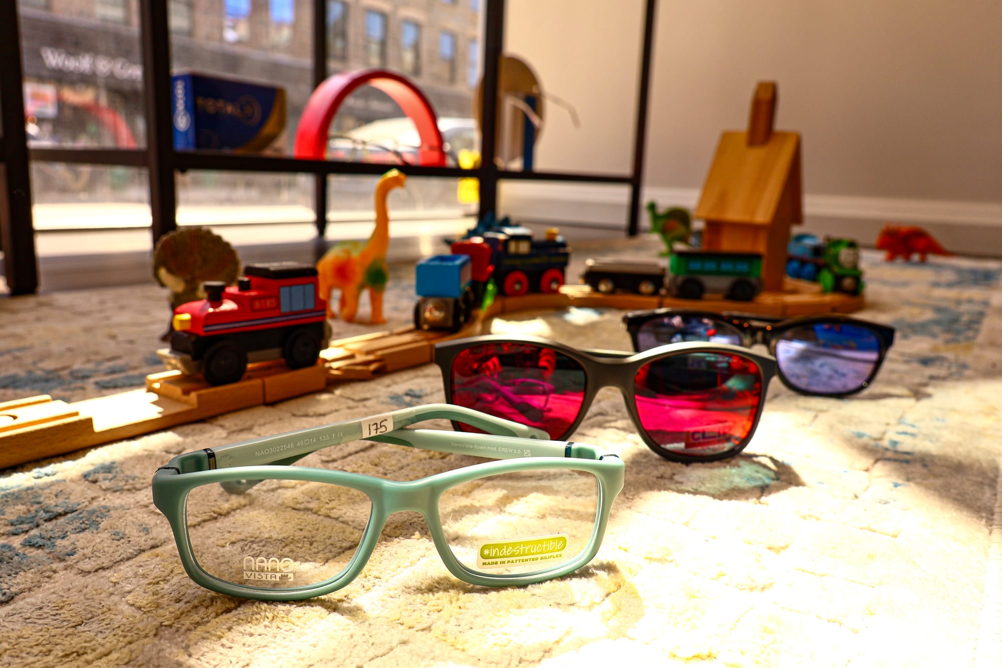 A child trying on glasses at Boardwalk Eye Care in Cambridge, Ontario